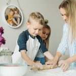 Mother and children enjoying a fun and messy baking session together at home.